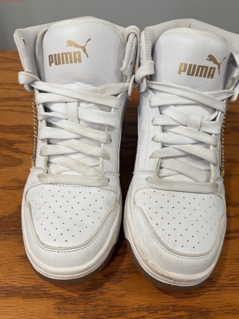 Puma White High-Top Sneakers with Gold Accents